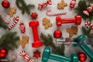 Healthy holiday season tips, Christmas decorations, dumbbells